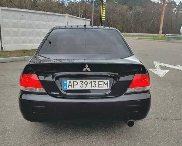 Чорний Міцубісі Lancer, об'ємом двигуна 1.58 л та пробігом 190 тис. км за 3750 $, фото 5 на Automoto.ua