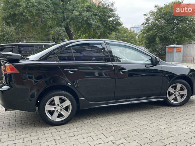 Черный Мицубиси Лансер, объемом двигателя 2 л и пробегом 200 тыс. км за 6199 $, фото 5 на Automoto.ua