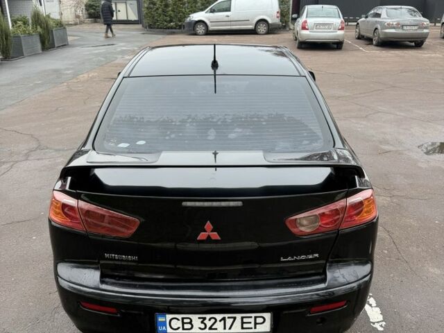 Черный Мицубиси Лансер, объемом двигателя 2 л и пробегом 281 тыс. км за 6000 $, фото 7 на Automoto.ua