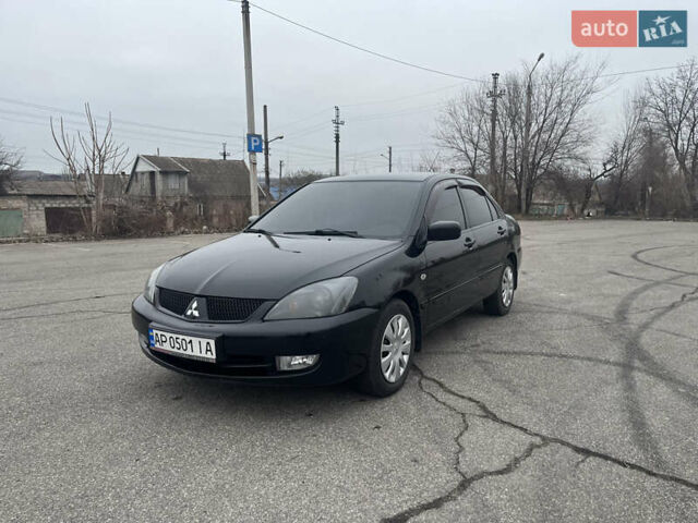 Чорний Міцубісі Lancer, об'ємом двигуна 1.58 л та пробігом 173 тис. км за 5099 $, фото 7 на Automoto.ua