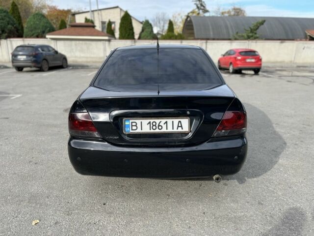 Чорний Міцубісі Lancer, об'ємом двигуна 1.6 л та пробігом 250 тис. км за 4800 $, фото 2 на Automoto.ua