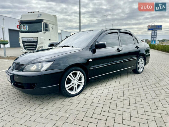 Чорний Міцубісі Lancer, об'ємом двигуна 2 л та пробігом 275 тис. км за 5300 $, фото 18 на Automoto.ua