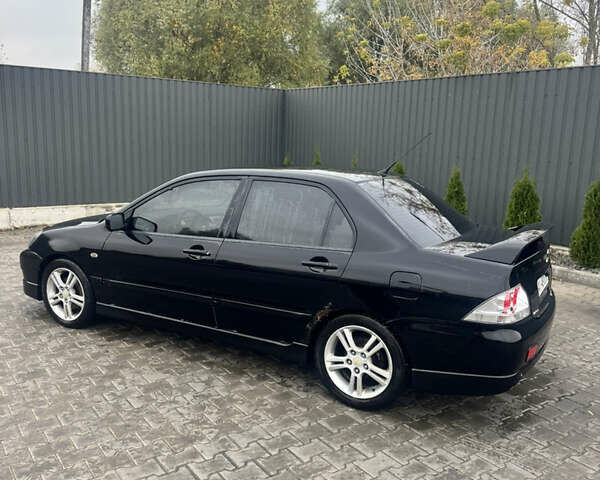 Чорний Міцубісі Lancer, об'ємом двигуна 2 л та пробігом 210 тис. км за 5500 $, фото 2 на Automoto.ua