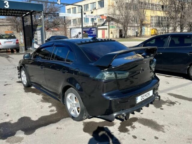 Чорний Міцубісі Lancer, об'ємом двигуна 2 л та пробігом 226 тис. км за 6700 $, фото 2 на Automoto.ua