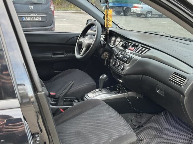 Чорний Міцубісі Lancer, об'ємом двигуна 1.6 л та пробігом 250 тис. км за 4800 $, фото 6 на Automoto.ua