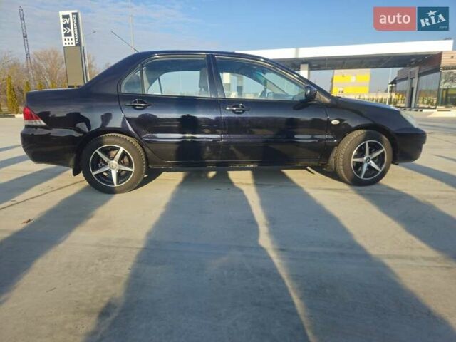 Чорний Міцубісі Lancer, об'ємом двигуна 1.59 л та пробігом 180 тис. км за 4999 $, фото 5 на Automoto.ua