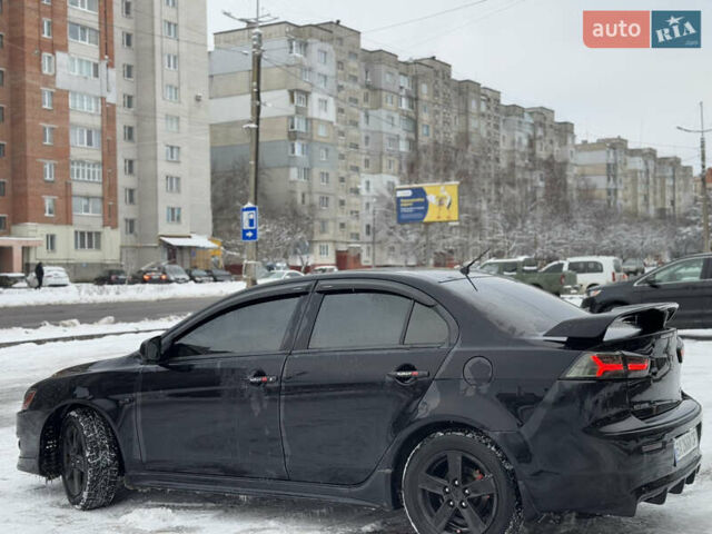 Черный Мицубиси Лансер, объемом двигателя 2 л и пробегом 215 тыс. км за 6600 $, фото 5 на Automoto.ua