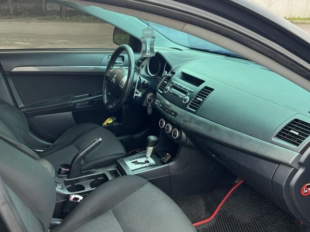 Черный Мицубиси Лансер, объемом двигателя 2 л и пробегом 350 тыс. км за 6700 $, фото 13 на Automoto.ua