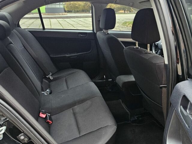 Черный Мицубиси Лансер, объемом двигателя 2 л и пробегом 115 тыс. км за 5000 $, фото 14 на Automoto.ua