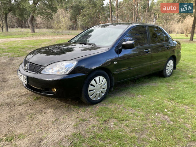 Чорний Міцубісі Lancer, об'ємом двигуна 1.6 л та пробігом 224 тис. км за 4950 $, фото 14 на Automoto.ua