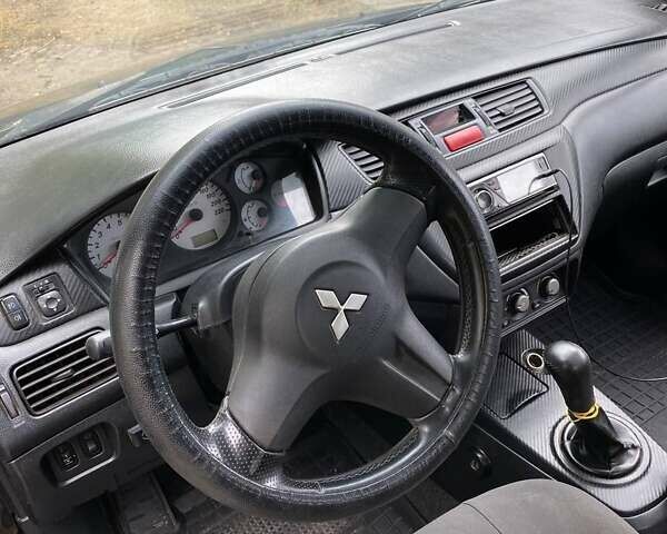 Чорний Міцубісі Lancer, об'ємом двигуна 1.58 л та пробігом 231 тис. км за 4300 $, фото 2 на Automoto.ua
