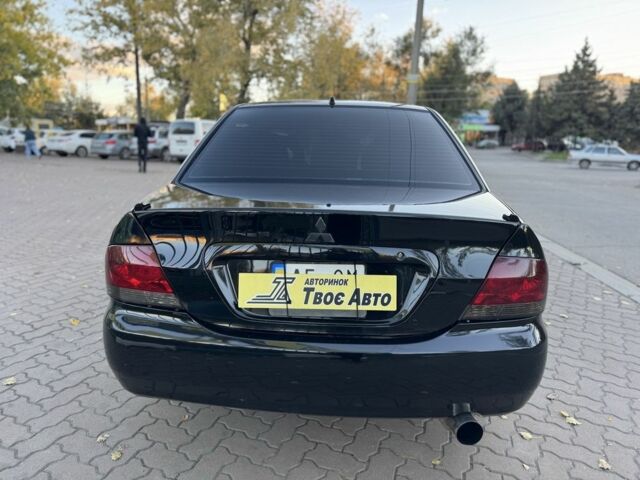 Черный Мицубиси Лансер, объемом двигателя 1.6 л и пробегом 320 тыс. км за 3500 $, фото 5 на Automoto.ua