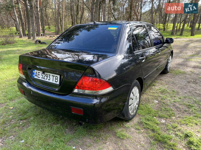 Чорний Міцубісі Lancer, об'ємом двигуна 1.6 л та пробігом 224 тис. км за 4950 $, фото 7 на Automoto.ua