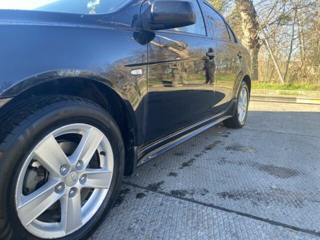 Черный Мицубиси Лансер, объемом двигателя 2 л и пробегом 372 тыс. км за 6200 $, фото 9 на Automoto.ua