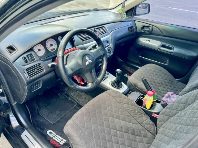 Чорний Міцубісі Lancer, об'ємом двигуна 1.6 л та пробігом 228 тис. км за 3499 $, фото 3 на Automoto.ua