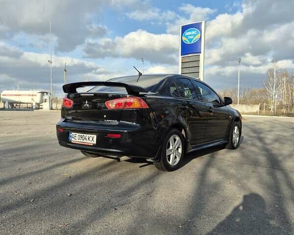 Черный Мицубиси Лансер, объемом двигателя 2 л и пробегом 224 тыс. км за 7000 $, фото 10 на Automoto.ua