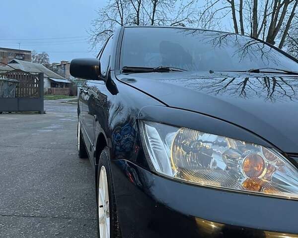 Черный Мицубиси Лансер, объемом двигателя 1.6 л и пробегом 249 тыс. км за 5000 $, фото 7 на Automoto.ua