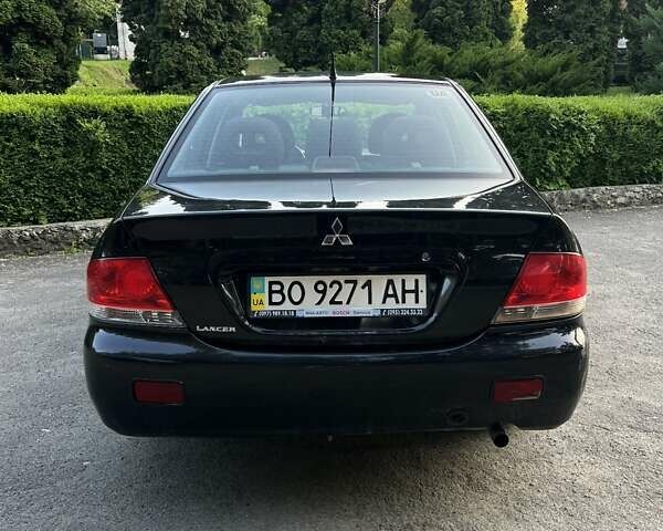 Черный Мицубиси Лансер, объемом двигателя 1.6 л и пробегом 131 тыс. км за 4350 $, фото 4 на Automoto.ua
