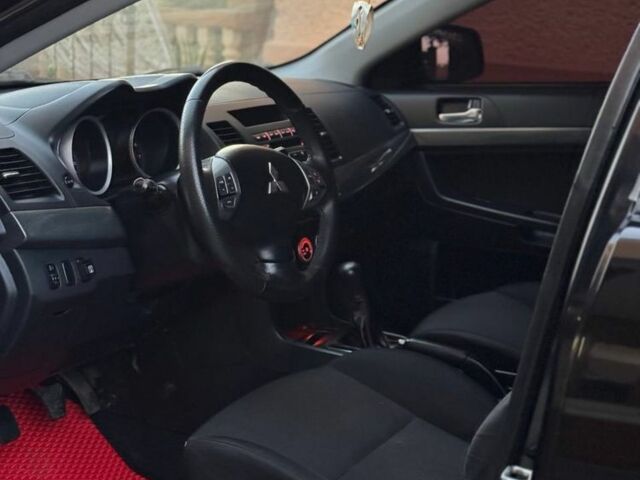 Черный Мицубиси Лансер, объемом двигателя 2 л и пробегом 247 тыс. км за 4700 $, фото 6 на Automoto.ua