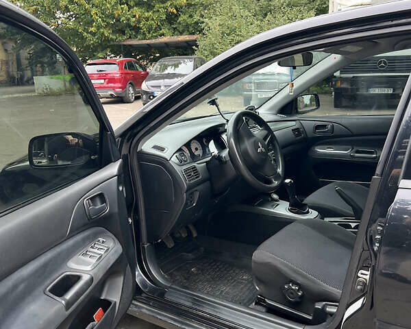 Чорний Міцубісі Lancer, об'ємом двигуна 1.58 л та пробігом 256 тис. км за 4200 $, фото 10 на Automoto.ua