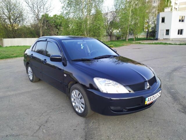 Черный Мицубиси Лансер, объемом двигателя 1.6 л и пробегом 32 тыс. км за 9000 $, фото 6 на Automoto.ua