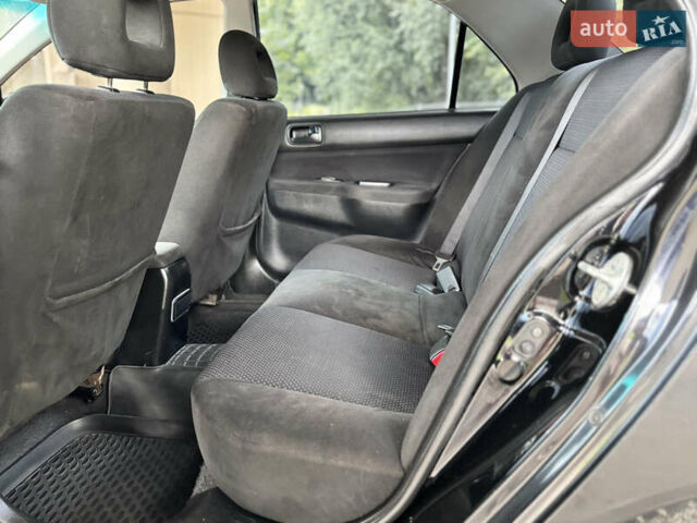 Чорний Міцубісі Lancer, об'ємом двигуна 1.6 л та пробігом 173 тис. км за 3700 $, фото 18 на Automoto.ua