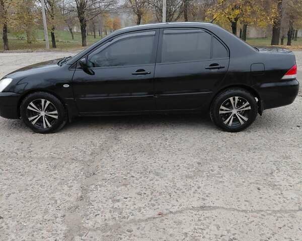 Чорний Міцубісі Lancer, об'ємом двигуна 1.58 л та пробігом 201 тис. км за 4500 $, фото 2 на Automoto.ua