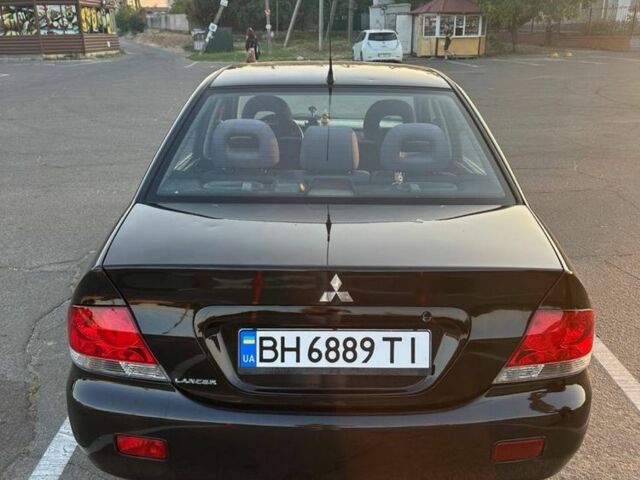 Чорний Міцубісі Lancer, об'ємом двигуна 1.6 л та пробігом 305 тис. км за 4900 $, фото 2 на Automoto.ua