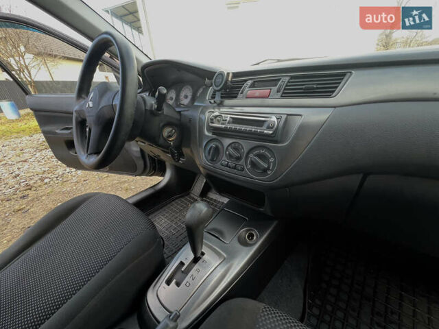 Чорний Міцубісі Lancer, об'ємом двигуна 1.58 л та пробігом 185 тис. км за 3750 $, фото 16 на Automoto.ua
