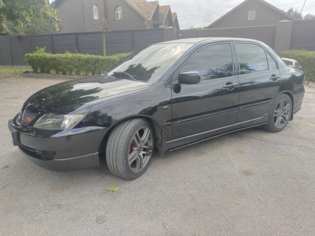 Міцубісі Lancer 2007 у Кам'янське (Дніпродзержинськ) на Automoto.ua Чорний Міцубісі Lancer, об'ємом двигуна 2 л та пробігом 268 тис. км за 5999 $, фото 1 на Automoto.ua
