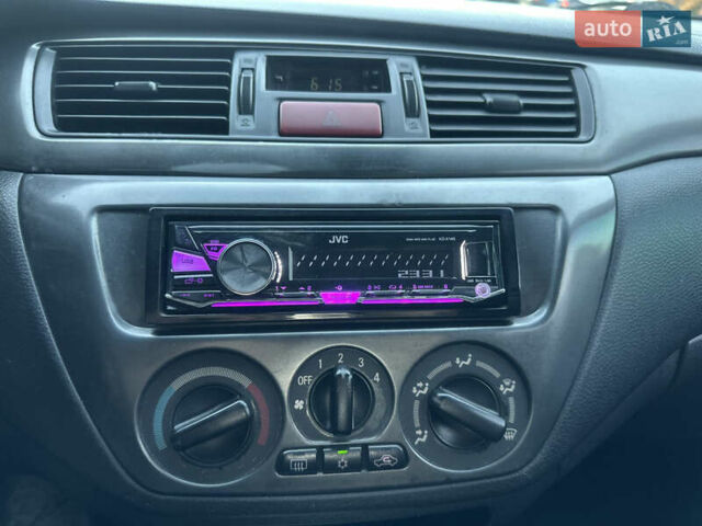 Черный Мицубиси Лансер, объемом двигателя 1.59 л и пробегом 269 тыс. км за 4999 $, фото 9 на Automoto.ua