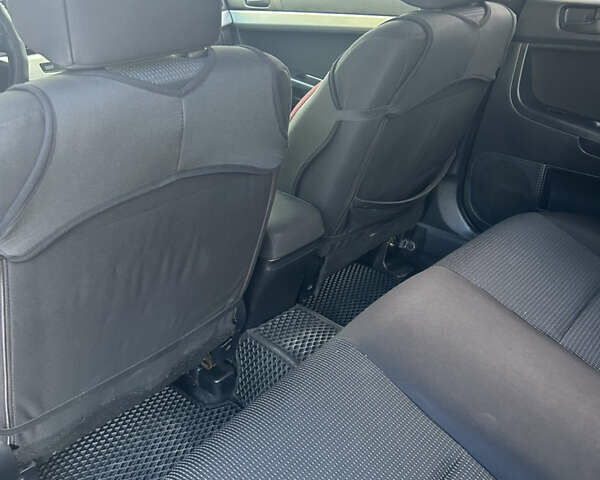 Черный Мицубиси Лансер, объемом двигателя 2 л и пробегом 208 тыс. км за 6500 $, фото 12 на Automoto.ua