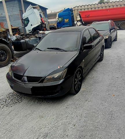 Чорний Міцубісі Lancer, об'ємом двигуна 2 л та пробігом 200 тис. км за 1800 $, фото 3 на Automoto.ua