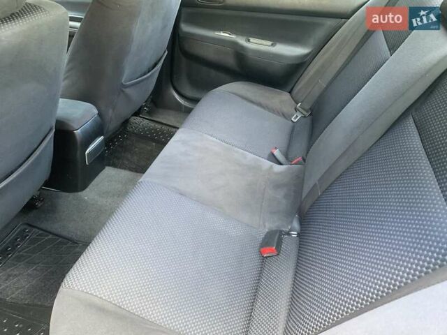 Черный Мицубиси Лансер, объемом двигателя 1.58 л и пробегом 237 тыс. км за 3950 $, фото 8 на Automoto.ua