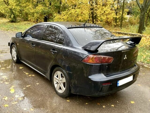 Черный Мицубиси Лансер, объемом двигателя 2 л и пробегом 280 тыс. км за 4600 $, фото 4 на Automoto.ua