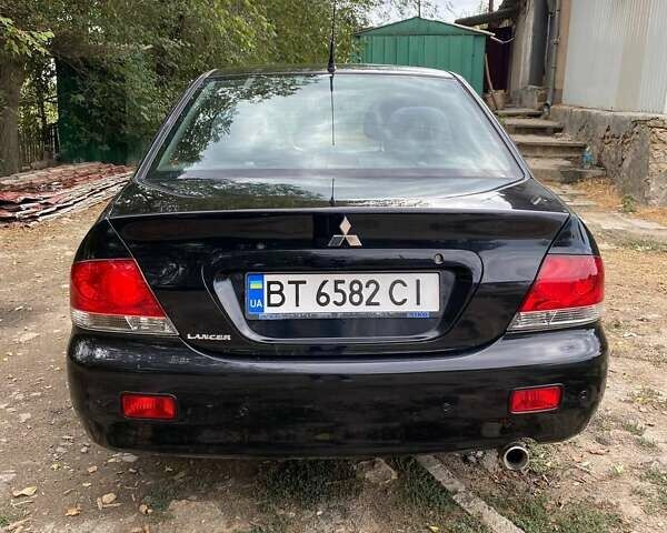 Чорний Міцубісі Lancer, об'ємом двигуна 1.58 л та пробігом 231 тис. км за 4300 $, фото 5 на Automoto.ua