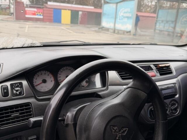 Черный Мицубиси Лансер, объемом двигателя 0 л и пробегом 240 тыс. км за 3300 $, фото 3 на Automoto.ua