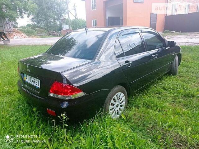 Чорний Міцубісі Lancer, об'ємом двигуна 1.58 л та пробігом 400 тис. км за 3700 $, фото 5 на Automoto.ua