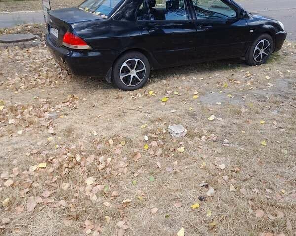 Чорний Міцубісі Lancer, об'ємом двигуна 1.6 л та пробігом 267 тис. км за 4100 $, фото 4 на Automoto.ua