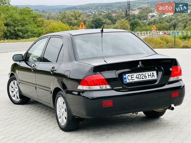 Чорний Міцубісі Lancer, об'ємом двигуна 1.6 л та пробігом 243 тис. км за 4950 $, фото 25 на Automoto.ua