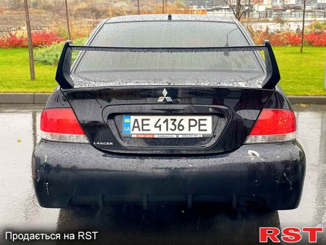 Чорний Міцубісі Lancer, об'ємом двигуна 1.6 л та пробігом 196 тис. км за 3900 $, фото 4 на Automoto.ua