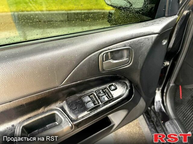 Чорний Міцубісі Lancer, об'ємом двигуна 1.6 л та пробігом 196 тис. км за 3900 $, фото 6 на Automoto.ua