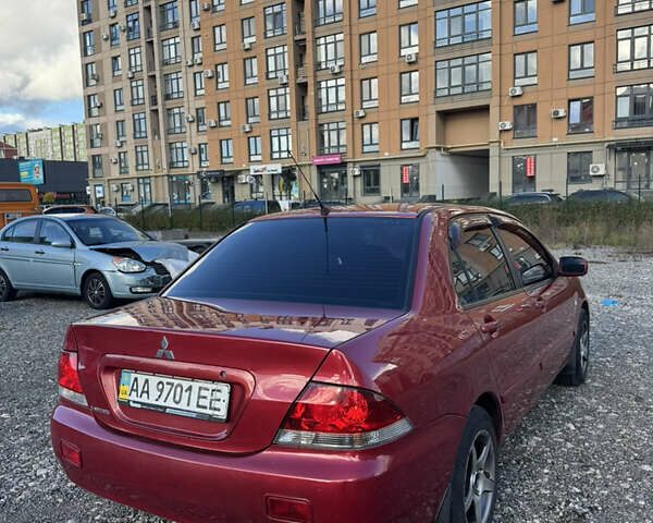 Чорний Міцубісі Lancer, об'ємом двигуна 1.6 л та пробігом 195 тис. км за 5000 $, фото 11 на Automoto.ua