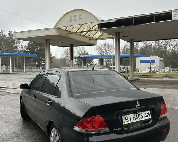 Черный Мицубиси Лансер, объемом двигателя 1.58 л и пробегом 254 тыс. км за 5000 $, фото 3 на Automoto.ua