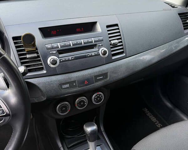 Черный Мицубиси Лансер, объемом двигателя 2 л и пробегом 219 тыс. км за 6400 $, фото 10 на Automoto.ua