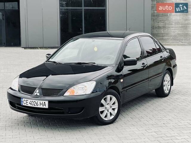 Чорний Міцубісі Lancer, об'ємом двигуна 1.6 л та пробігом 243 тис. км за 4950 $, фото 4 на Automoto.ua
