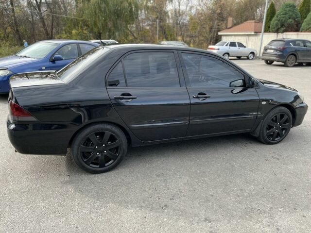 Чорний Міцубісі Lancer, об'ємом двигуна 1.6 л та пробігом 250 тис. км за 4800 $, фото 3 на Automoto.ua