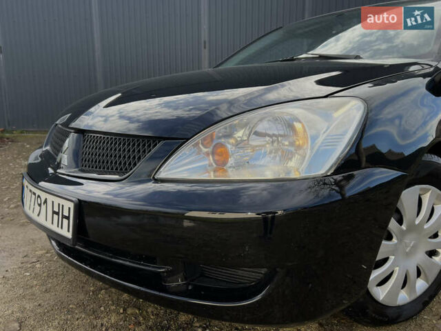 Чорний Міцубісі Lancer, об'ємом двигуна 1.58 л та пробігом 185 тис. км за 3750 $, фото 9 на Automoto.ua