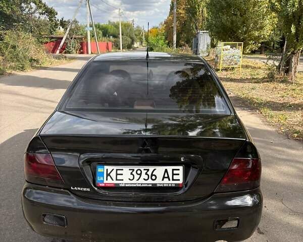 Черный Мицубиси Лансер, объемом двигателя 1.6 л и пробегом 244 тыс. км за 4100 $, фото 1 на Automoto.ua