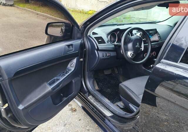 Черный Мицубиси Лансер, объемом двигателя 2 л и пробегом 230 тыс. км за 7100 $, фото 2 на Automoto.ua